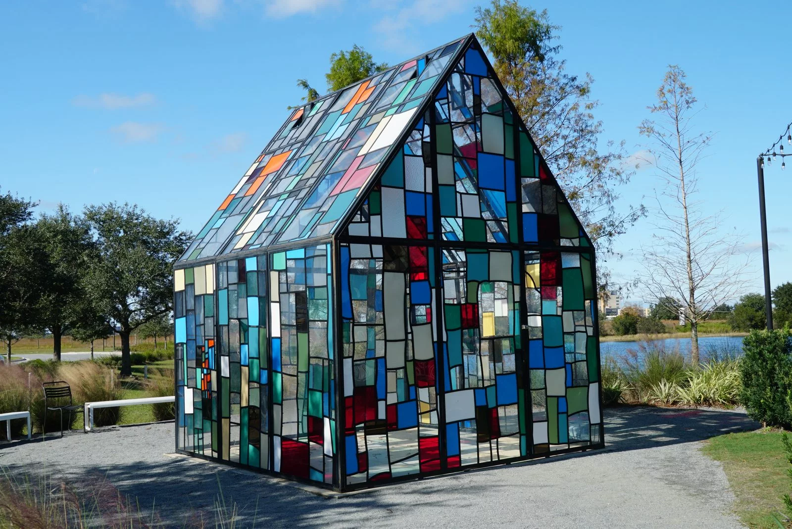 stained glass house by water